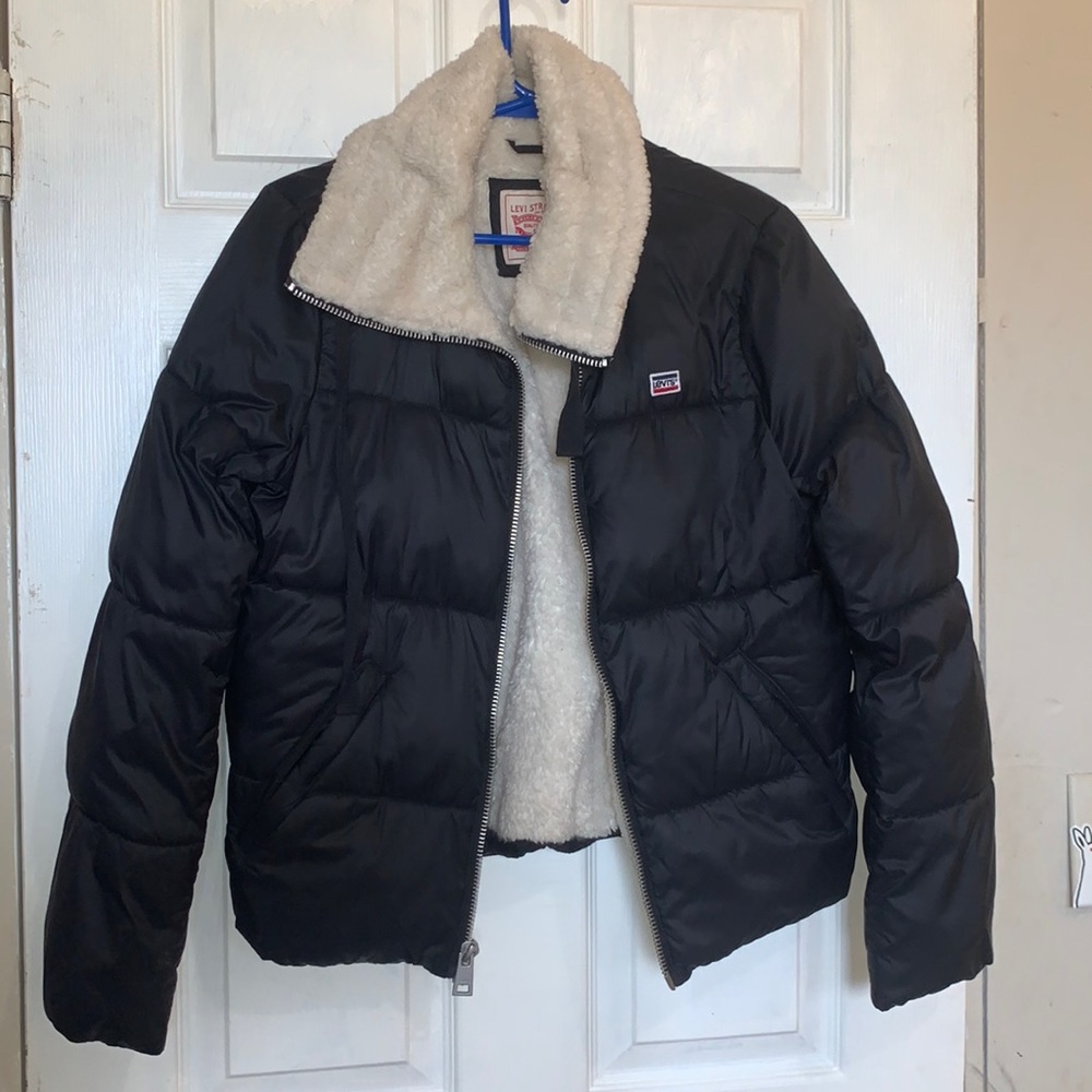 Levi’s black jacket with white fur on the inside